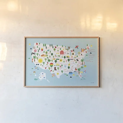 Fun USA Map by Ann Kelle. shown as a paper print in a natural frame. Available as a archival giclee rolled canvas, fine art paper, or poster print. SKU 62580i.