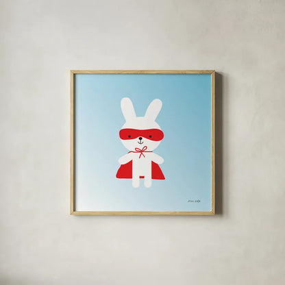 Rabbit Super Hero by Ann Kelle. Shown in a natural wood glass frame for a timeless modern aesthetic. Available as an archival giclee rolled canvas, fine art paper, or poster print. SKU 55595a.
