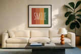 Smile Rainbow Retro by Ann Kelle. Displayed in a glass frame with matte in a clean modern living room. Available as an archival giclee rolled canvas, fine art paper, or poster print. SKU 56931a.