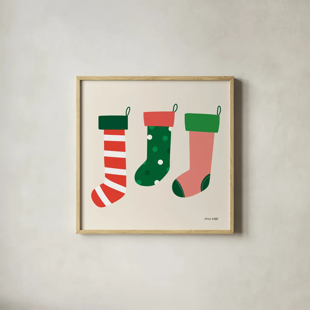 Three Stockings by Ann Kelle. Shown in a natural wood glass frame for a timeless modern aesthetic. Available as an archival giclee rolled canvas, fine art paper, or poster print. SKU 81237a.