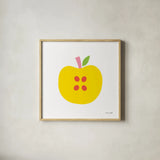 Yellow Apple by Ann Kelle. Shown in a natural wood glass frame for a timeless modern aesthetic. Available as an archival giclee rolled canvas, fine art paper, or poster print. SKU 55614a.