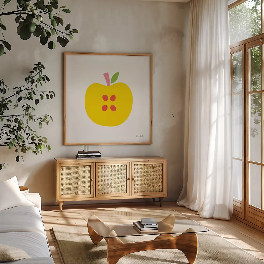Yellow Apple by Ann Kelle. Shown in a natural wood frame in a cozy modern living room. Available as an archival giclee rolled canvas, fine art paper, or poster print. SKU 55614a.