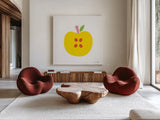 Yellow Apple by Ann Kelle. Shown as extra-large giant wall art in a modern living room. Available as an archival giclee rolled canvas, fine art paper, or poster print. SKU 55614a.
