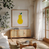 Yellow Pear by Ann Kelle. Shown in a natural wood frame in a cozy modern living room. Available as an archival giclee rolled canvas, fine art paper, or poster print. SKU 55616a.