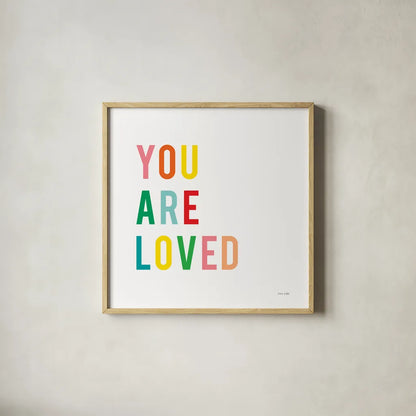 You are Loved by Ann Kelle. Shown in a natural wood glass frame for a timeless modern aesthetic. Available as an archival giclee rolled canvas, fine art paper, or poster print. SKU 56441a.