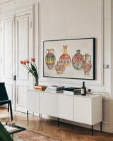 African Flair I by Anne Tavoletti. shown as a framed stretched canvas in a living room above a console. Available as a archival giclee rolled canvas, fine art paper, or poster print. SKU 69440i.