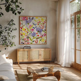 Annes Flowers I Crop by Anne Tavoletti. Shown in a natural wood frame in a cozy modern living room. Available as an archival giclee rolled canvas, fine art paper, or poster print. SKU 13943a.