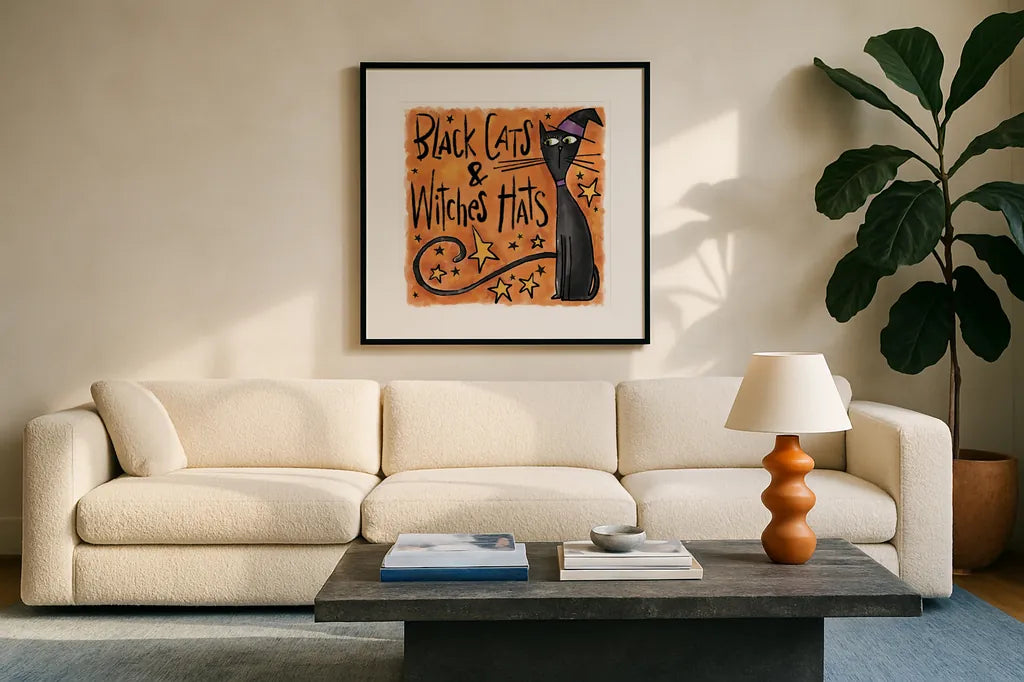 Black Cats and Witches Hats I by Anne Tavoletti. Displayed in a glass frame with matte in a clean modern living room. Available as an archival giclee rolled canvas, fine art paper, or poster print. SKU 73732a.