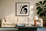 Black and White Abstract III by Anne Tavoletti. Displayed in a glass frame with matte in a clean modern living room. Available as an archival giclee rolled canvas, fine art paper, or poster print. SKU 77914a.