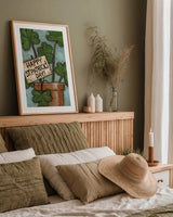 Clover Pot by Anne Tavoletti. shown as a paper print in a natural frame. Available as a archival giclee rolled canvas, fine art paper, or poster print. SKU 56644h.