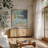Coastal Breeze Quotes I by Anne Tavoletti. Shown in a natural wood frame in a cozy modern living room. Available as an archival giclee rolled canvas, fine art paper, or poster print. SKU 21355a.