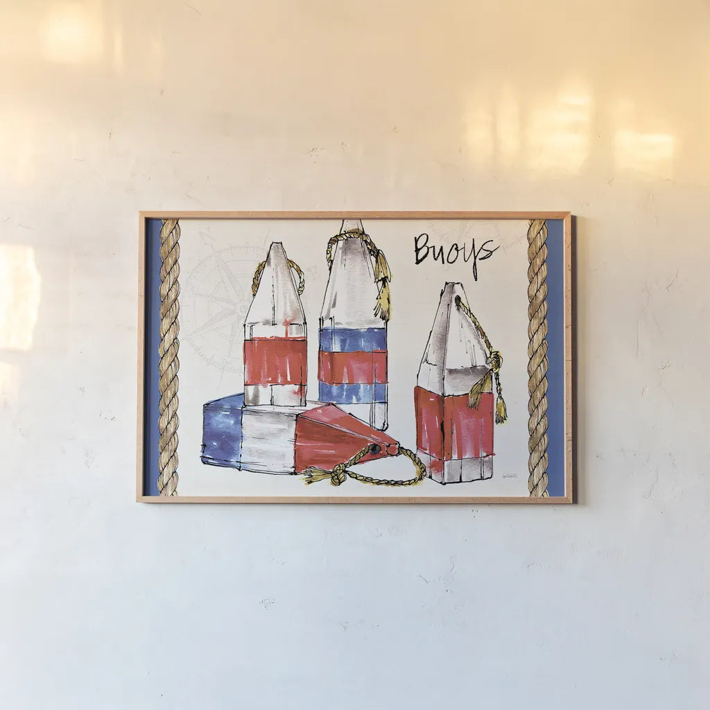 Coastal Buoys I by Anne Tavoletti. shown as a paper print in a natural frame. Available as a archival giclee rolled canvas, fine art paper, or poster print. SKU 43273i.