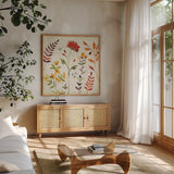 Fall Blooms I by Anne Tavoletti. Shown in a natural wood frame in a cozy modern living room. Available as an archival giclee rolled canvas, fine art paper, or poster print. SKU 17748a.