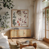 Festive Blooms III by Anne Tavoletti. Shown in a natural wood frame in a cozy modern living room. Available as an archival giclee rolled canvas, fine art paper, or poster print. SKU 97834a.
