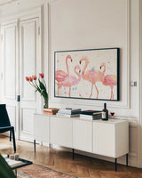 Flamingo Fever I by Anne Tavoletti. shown as a framed stretched canvas in a living room above a console. Available as a archival giclee rolled canvas, fine art paper, or poster print. SKU 21106i.