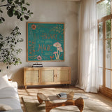 Garden Fairies Blue VIII by Anne Tavoletti. Shown in a natural wood frame in a cozy modern living room. Available as an archival giclee rolled canvas, fine art paper, or poster print. SKU 95348a.