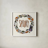 Halloween Wreath I by Anne Tavoletti. Shown in a crisp white glass frame for a clean and minimalist style. Available as an archival giclee rolled canvas, fine art paper, or poster print. SKU 77347a.