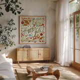Happy Fall I by Anne Tavoletti. Shown in a natural wood frame in a cozy modern living room. Available as an archival giclee rolled canvas, fine art paper, or poster print. SKU 65840a.