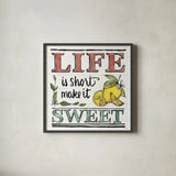 Lemonade Stand V by Anne Tavoletti. Shown in a sleek black glass frame for a contemporary gallery look. Available as an archival giclee rolled canvas, fine art paper, or poster print. SKU 69026a.