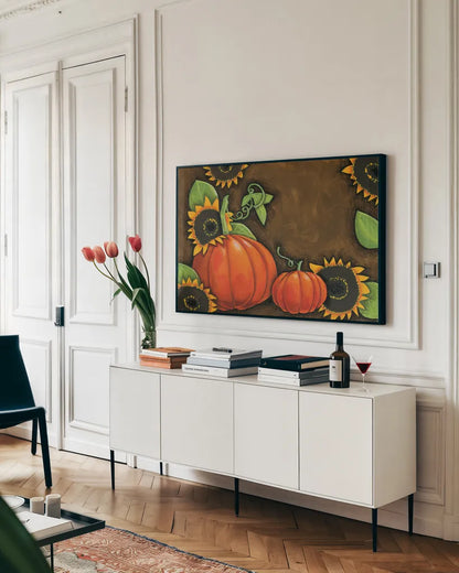 Pumpkins and Sunflowers by Anne Tavoletti. shown as a framed stretched canvas in a living room above a console. Available as a archival giclee rolled canvas, fine art paper, or poster print. SKU 26711i.