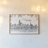 Skyline Sketches VII by Anne Tavoletti. shown as a paper print in a natural frame. Available as a archival giclee rolled canvas, fine art paper, or poster print. SKU 61209i.