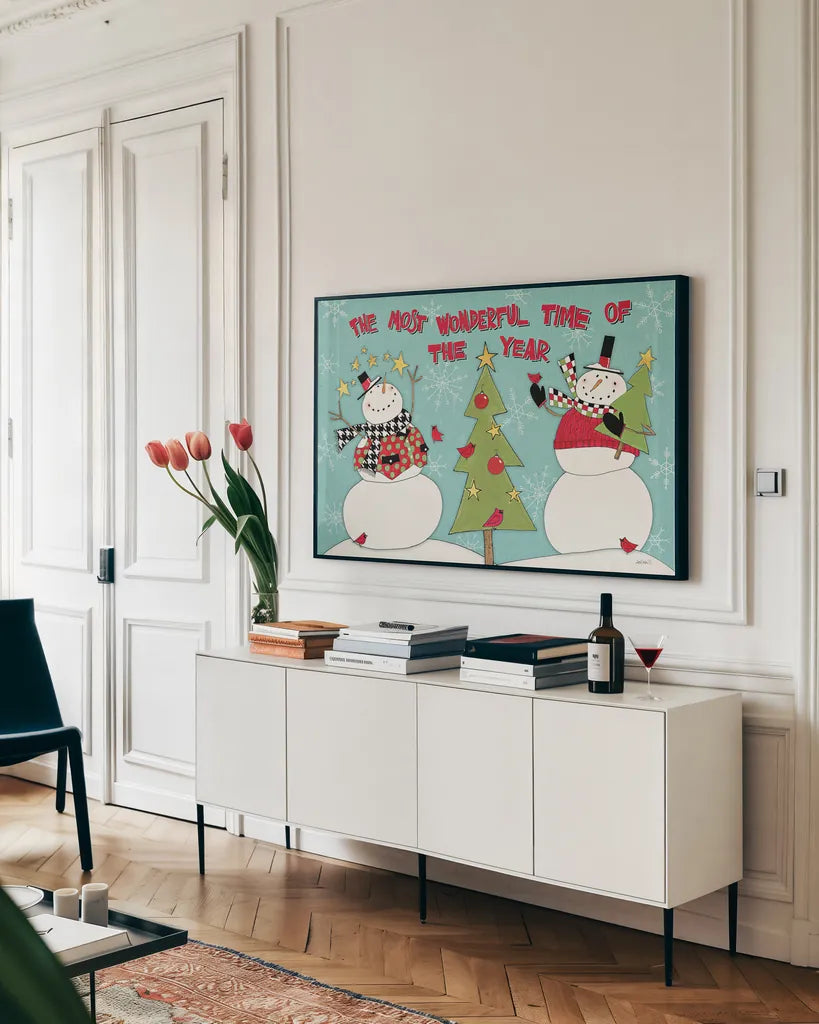 Snowman Sentiments I by Anne Tavoletti. shown as a framed stretched canvas in a living room above a console. Available as a archival giclee rolled canvas, fine art paper, or poster print. SKU 31819i.