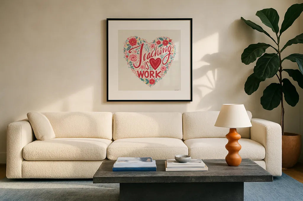 Teaching is Heart Work I by Anne Tavoletti. Displayed in a glass frame with matte in a clean modern living room. Available as an archival giclee rolled canvas, fine art paper, or poster print. SKU 60837a.
