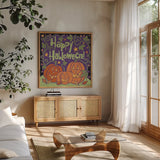 Three Halloween Pumpkins I by Anne Tavoletti. Shown in a natural wood frame in a cozy modern living room. Available as an archival giclee rolled canvas, fine art paper, or poster print. SKU 73733a.