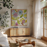 Watercolor Flowers by Anne Tavoletti. Shown in a natural wood frame in a cozy modern living room. Available as an archival giclee rolled canvas, fine art paper, or poster print. SKU 18035a.