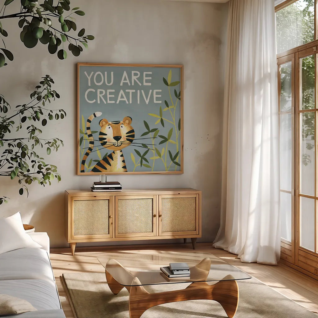 You Are Creative by Anne Tavoletti. Shown in a natural wood frame in a cozy modern living room. Available as an archival giclee rolled canvas, fine art paper, or poster print. SKU 18512a.