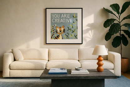 You Are Creative by Anne Tavoletti. Displayed in a glass frame with matte in a clean modern living room. Available as an archival giclee rolled canvas, fine art paper, or poster print. SKU 18512a.