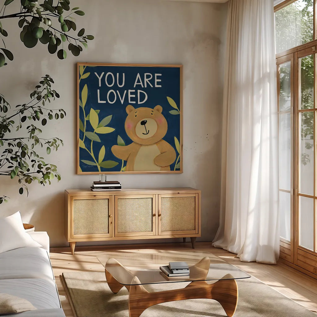 You Are Loved by Anne Tavoletti. Shown in a natural wood frame in a cozy modern living room. Available as an archival giclee rolled canvas, fine art paper, or poster print. SKU 18510a.