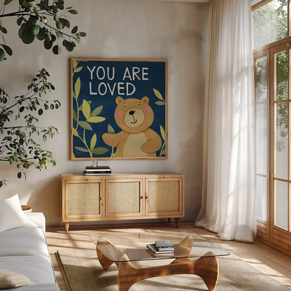 You Are Loved by Anne Tavoletti. Shown in a natural wood frame in a cozy modern living room. Available as an archival giclee rolled canvas, fine art paper, or poster print. SKU 18510a.