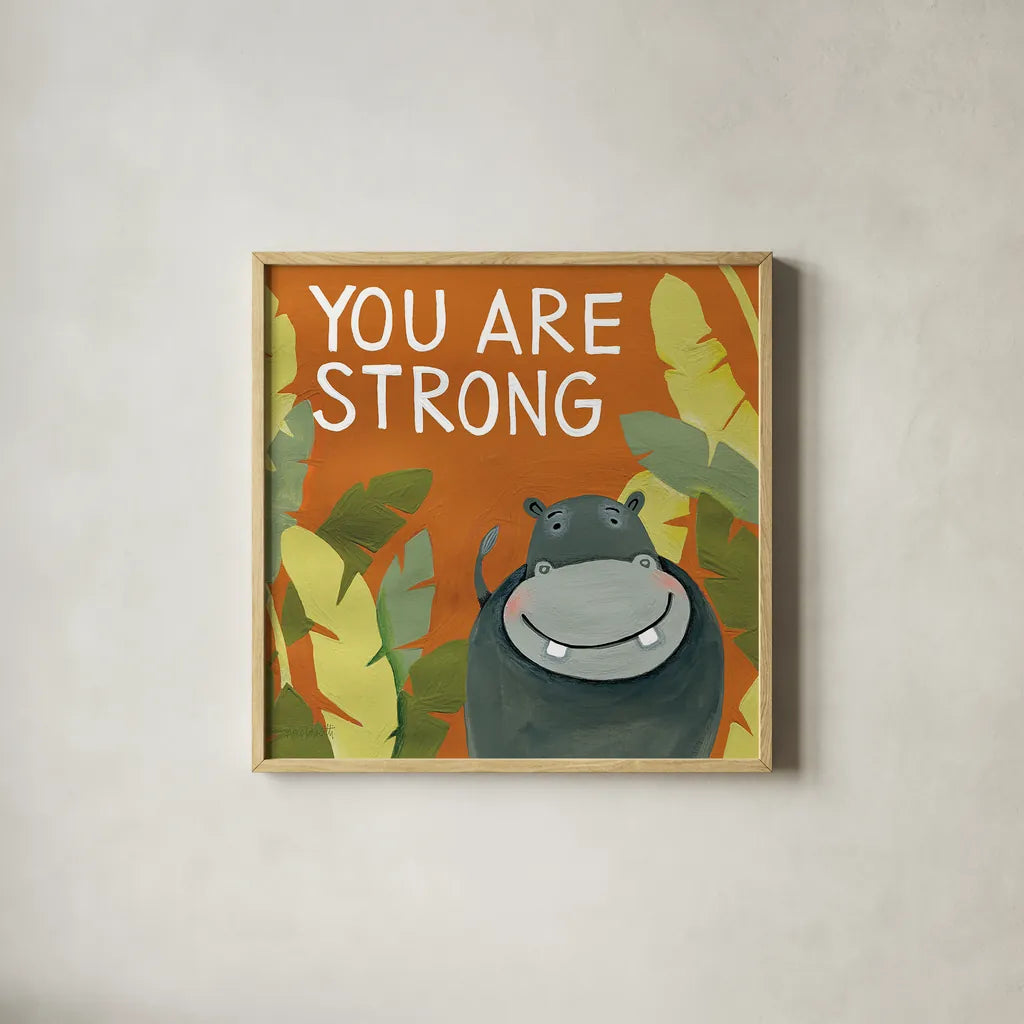 You Are Strong by Anne Tavoletti. Shown in a natural wood glass frame for a timeless modern aesthetic. Available as an archival giclee rolled canvas, fine art paper, or poster print. SKU 18513a.