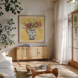 Zinnias in Pitcher by Anne Tavoletti. Shown in a natural wood frame in a cozy modern living room. Available as an archival giclee rolled canvas, fine art paper, or poster print. SKU 100599a.
