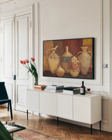 Autumn Urns III by Avery Tillmon. shown as a framed stretched canvas in a living room above a console. Available as a archival giclee rolled canvas, fine art paper, or poster print. SKU 4139i.