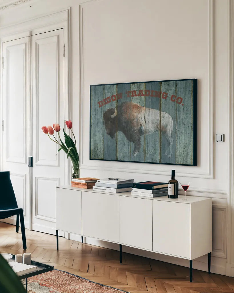 Bison Trading Co by Avery Tillmon. shown as a framed stretched canvas in a living room above a console. Available as a archival giclee rolled canvas, fine art paper, or poster print. SKU 57492i.