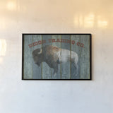 Bison Trading Co by Avery Tillmon. shown as a paper print in a black flame. Available as a archival giclee rolled canvas, fine art paper, or poster print. SKU 57492i.