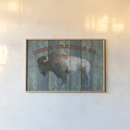 Bison Trading Co by Avery Tillmon. shown as a paper print in a natural frame. Available as a archival giclee rolled canvas, fine art paper, or poster print. SKU 57492i.