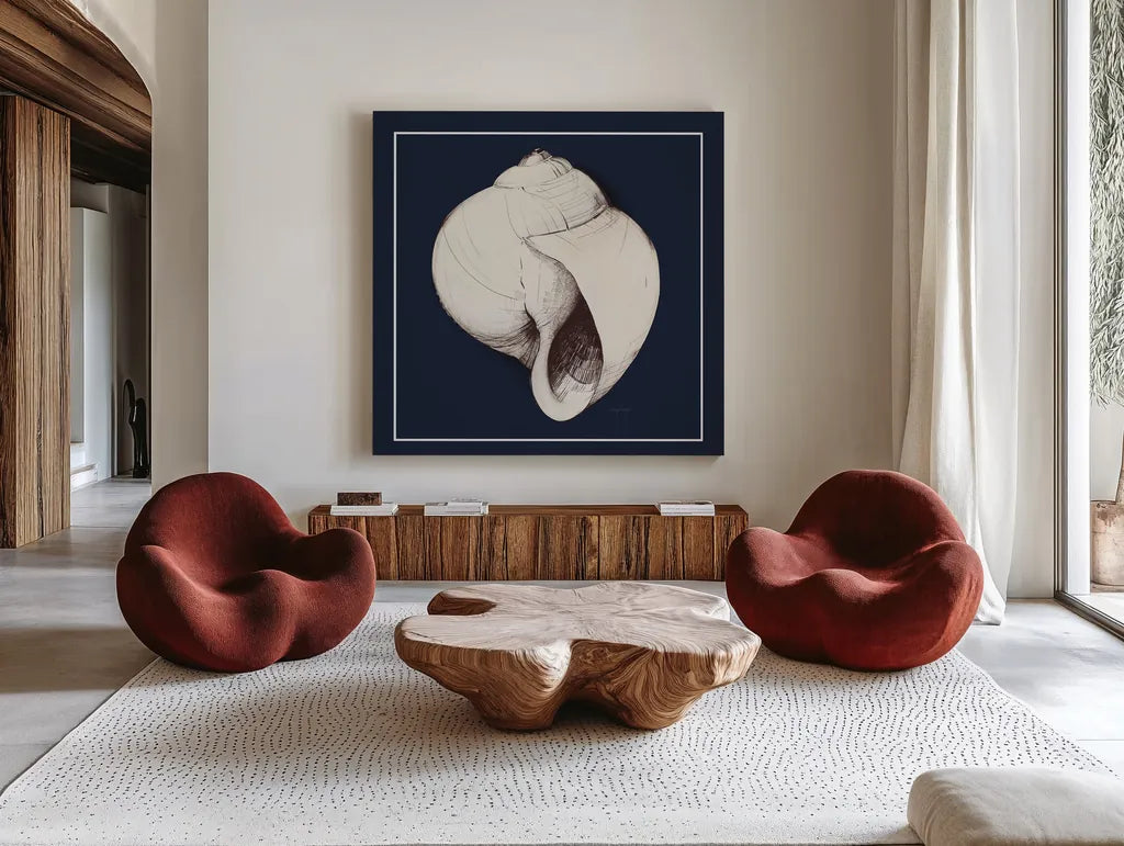 Coastal Shell I with Border Navy by Avery Tillmon. Shown as extra-large giant wall art in a modern living room. Available as an archival giclee rolled canvas, fine art paper, or poster print. SKU 56156a.