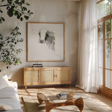 Cow II Dark Square by Avery Tillmon. Shown in a natural wood frame in a cozy modern living room. Available as an archival giclee rolled canvas, fine art paper, or poster print. SKU 36141a.