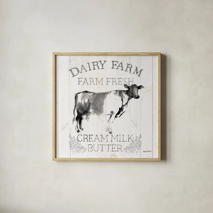 Dairy Farm Wood Black Cow Sq by Avery Tillmon. Shown in a natural wood glass frame for a timeless modern aesthetic. Available as an archival giclee rolled canvas, fine art paper, or poster print. SKU 81173a.