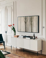 Down to the Woods on White Crop by Avery Tillmon. shown as a framed stretched canvas in a living room above a console. Available as a archival giclee rolled canvas, fine art paper, or poster print. SKU 14224i.