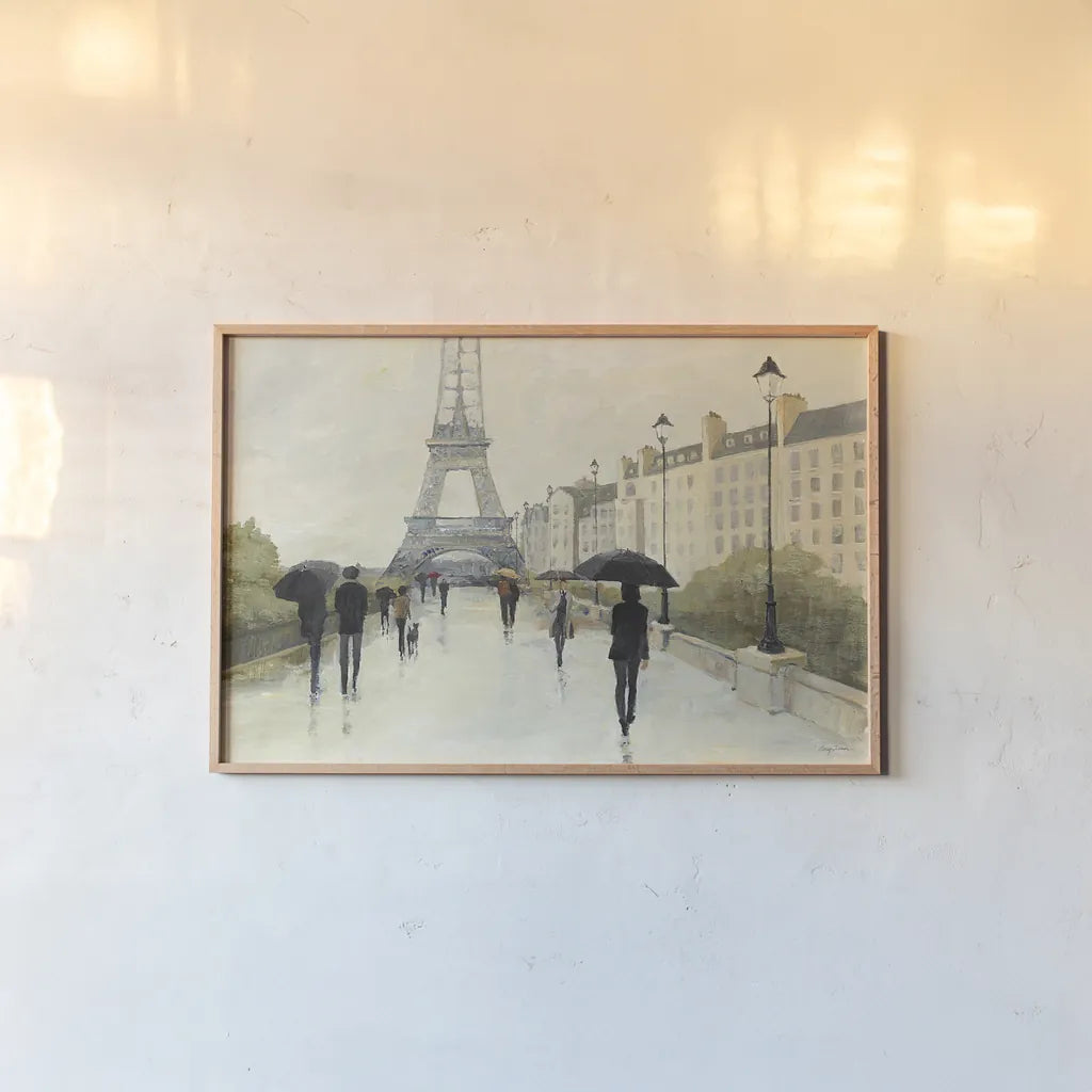 Eiffel in the Rain by Avery Tillmon. shown as a paper print in a natural frame. Available as a archival giclee rolled canvas, fine art paper, or poster print. SKU 16714i.