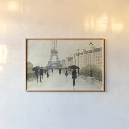 Eiffel in the Rain by Avery Tillmon. shown as a paper print in a natural frame. Available as a archival giclee rolled canvas, fine art paper, or poster print. SKU 16714i.