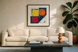 Geo Bright Primary by Avery Tillmon. Displayed in a glass frame with matte in a clean modern living room. Available as an archival giclee rolled canvas, fine art paper, or poster print. SKU 82313a.