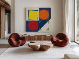 Geo Bright Primary by Avery Tillmon. Shown as extra-large giant wall art in a modern living room. Available as an archival giclee rolled canvas, fine art paper, or poster print. SKU 82313a.