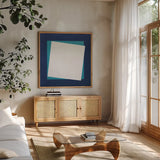 Geo Core Blue by Avery Tillmon. Shown in a natural wood frame in a cozy modern living room. Available as an archival giclee rolled canvas, fine art paper, or poster print. SKU 72254a.