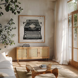 Graffiti Typewriter by Avery Tillmon. Shown in a natural wood frame in a cozy modern living room. Available as an archival giclee rolled canvas, fine art paper, or poster print. SKU 72774a.