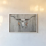 Longhorn on Dark Gray Wood by Avery Tillmon. shown as a paper print in a white frame. Available as a archival giclee rolled canvas, fine art paper, or poster print. SKU 29801i.